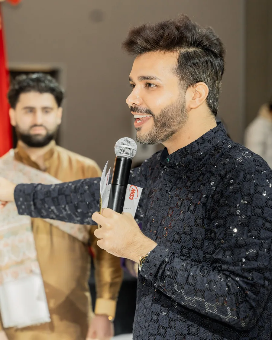 Vinay Batra, The Modish Monk, hosting with a microphone